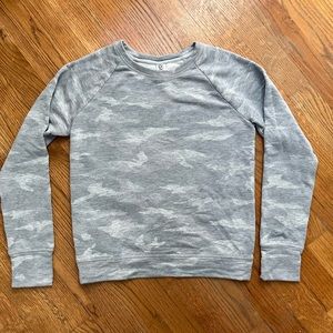 Athleta Girl sweatshirt. Size 12. Gray camo. Excellent condition.